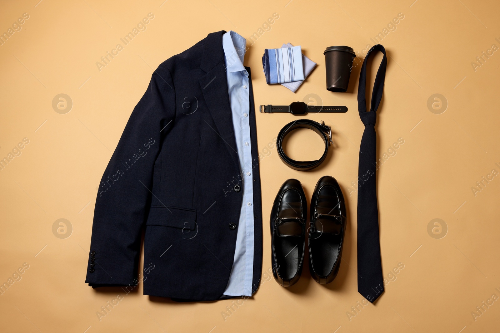 Photo of Elegant men's outfit. Stylish clothes, accessories and shoes on beige background, flat lay