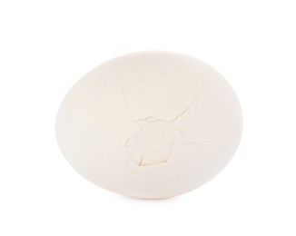 Photo of One egg with cracked shell isolated on white