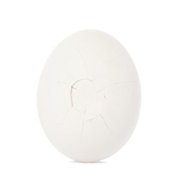 Photo of One egg with cracked shell isolated on white