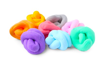 Photo of Different colorful play dough isolated on white