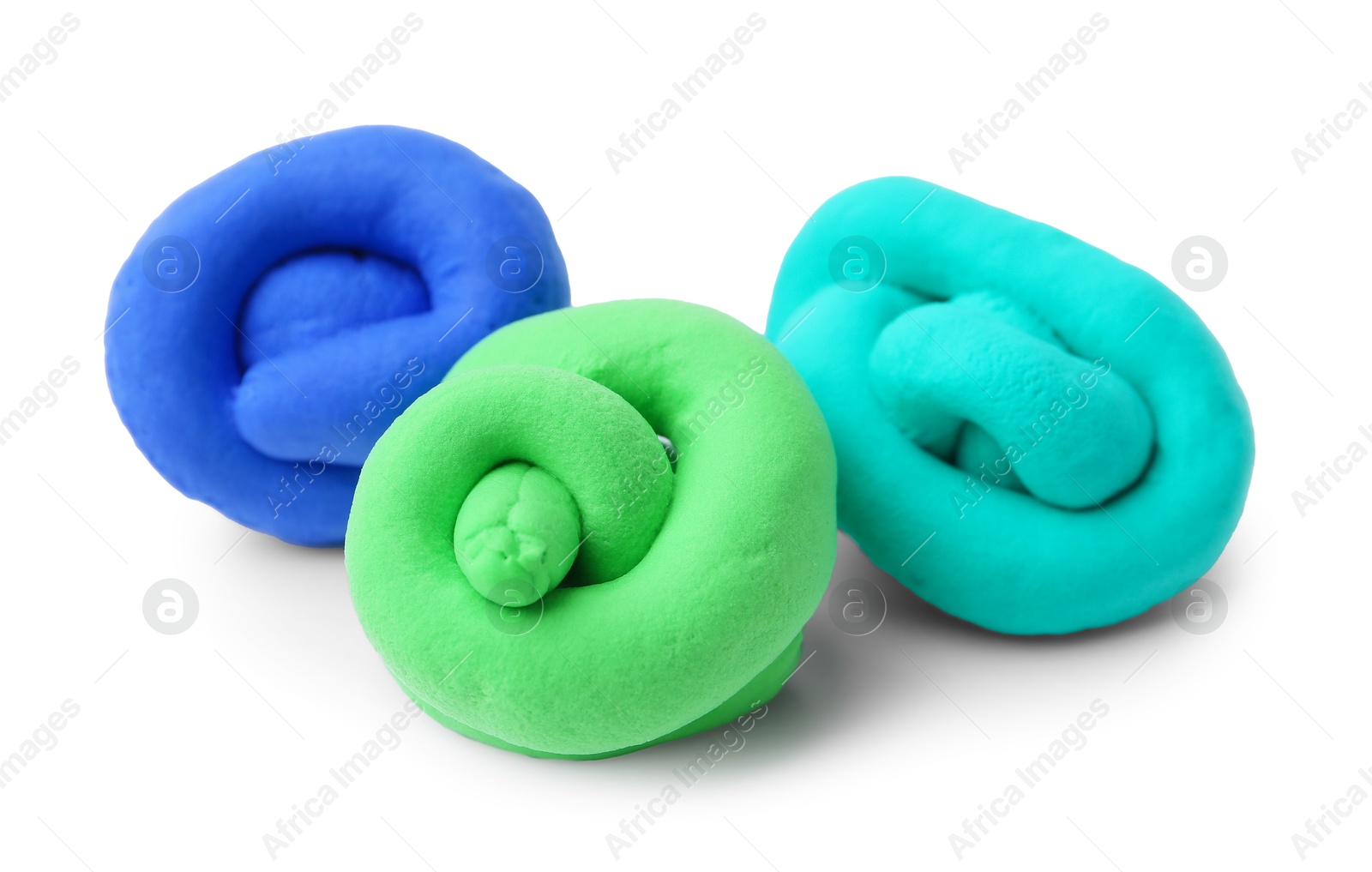 Photo of Different colorful play dough isolated on white