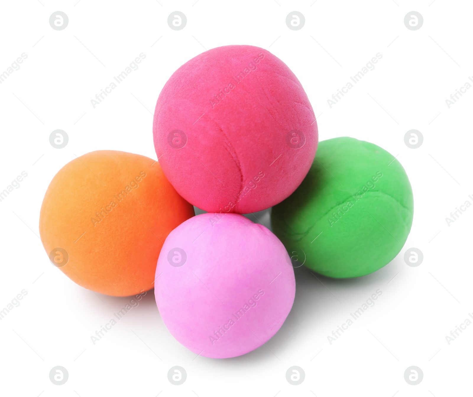 Photo of Different colorful play dough balls isolated on white