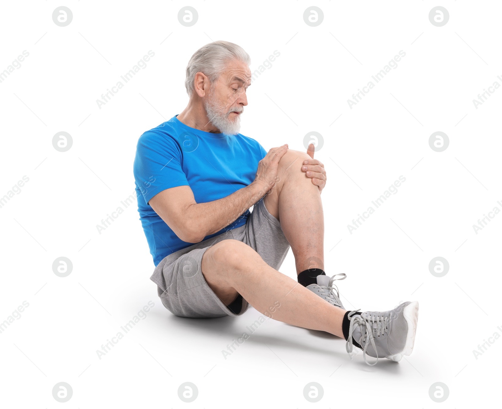 Photo of Senior man suffering from knee pain on white background