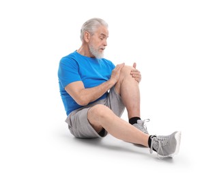 Photo of Senior man suffering from knee pain on white background