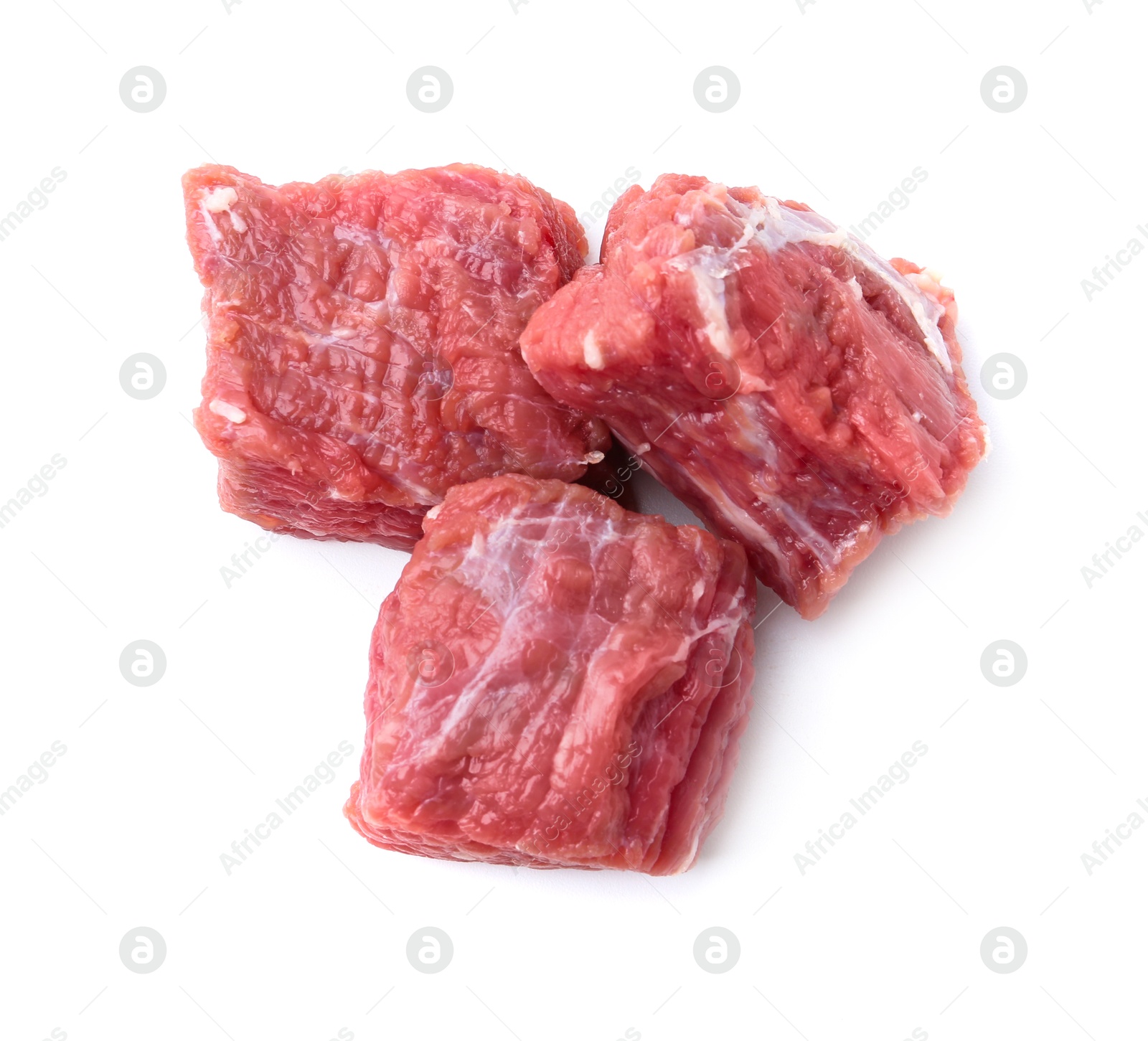 Photo of Pieces of raw beef meat isolated on white, top view