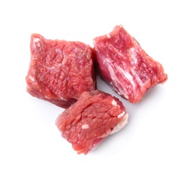 Photo of Pieces of raw beef meat isolated on white, top view