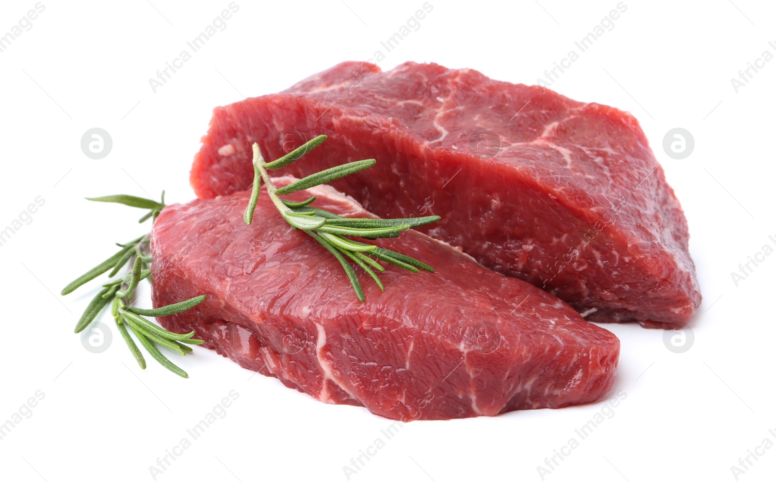 Photo of Pieces of raw beef meat with rosemary isolated on white