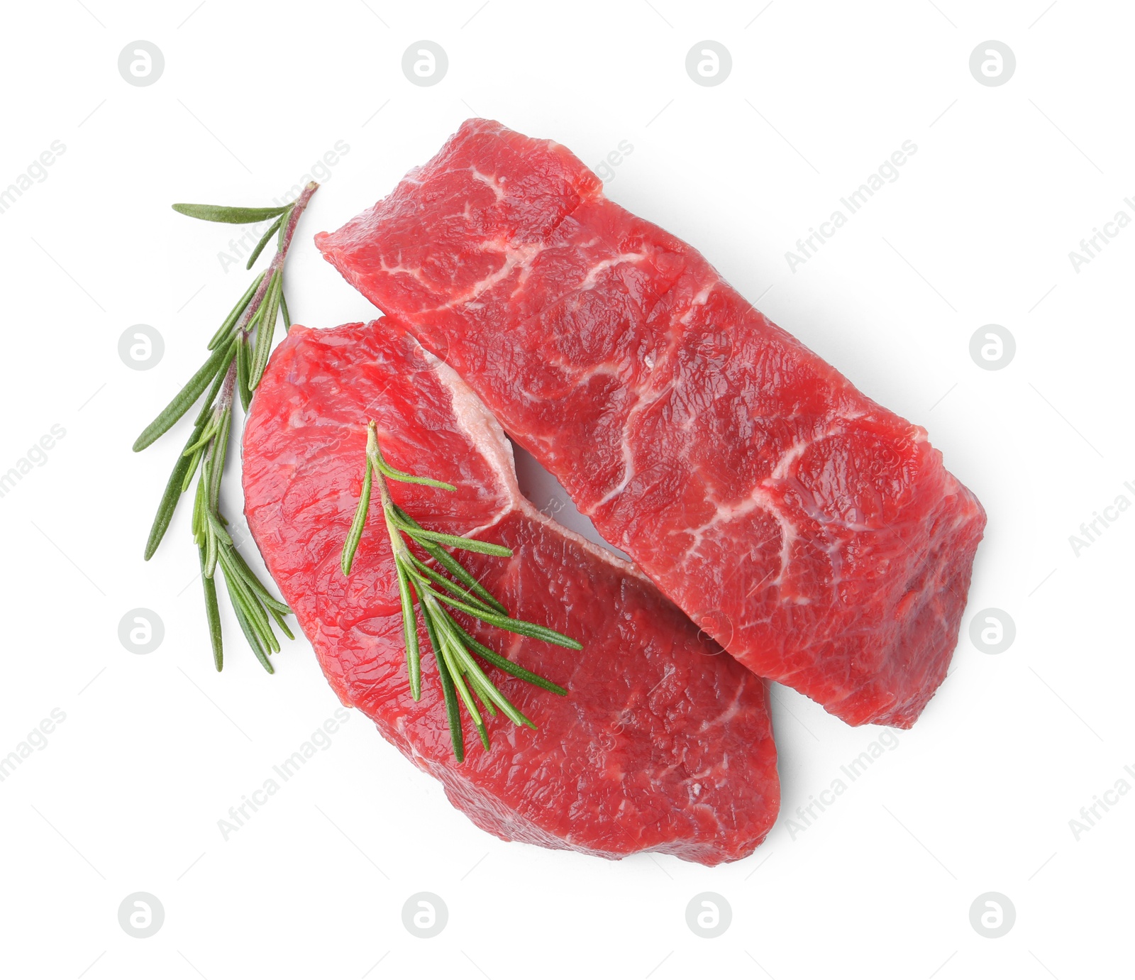 Photo of Pieces of raw beef meat with rosemary isolated on white, top view