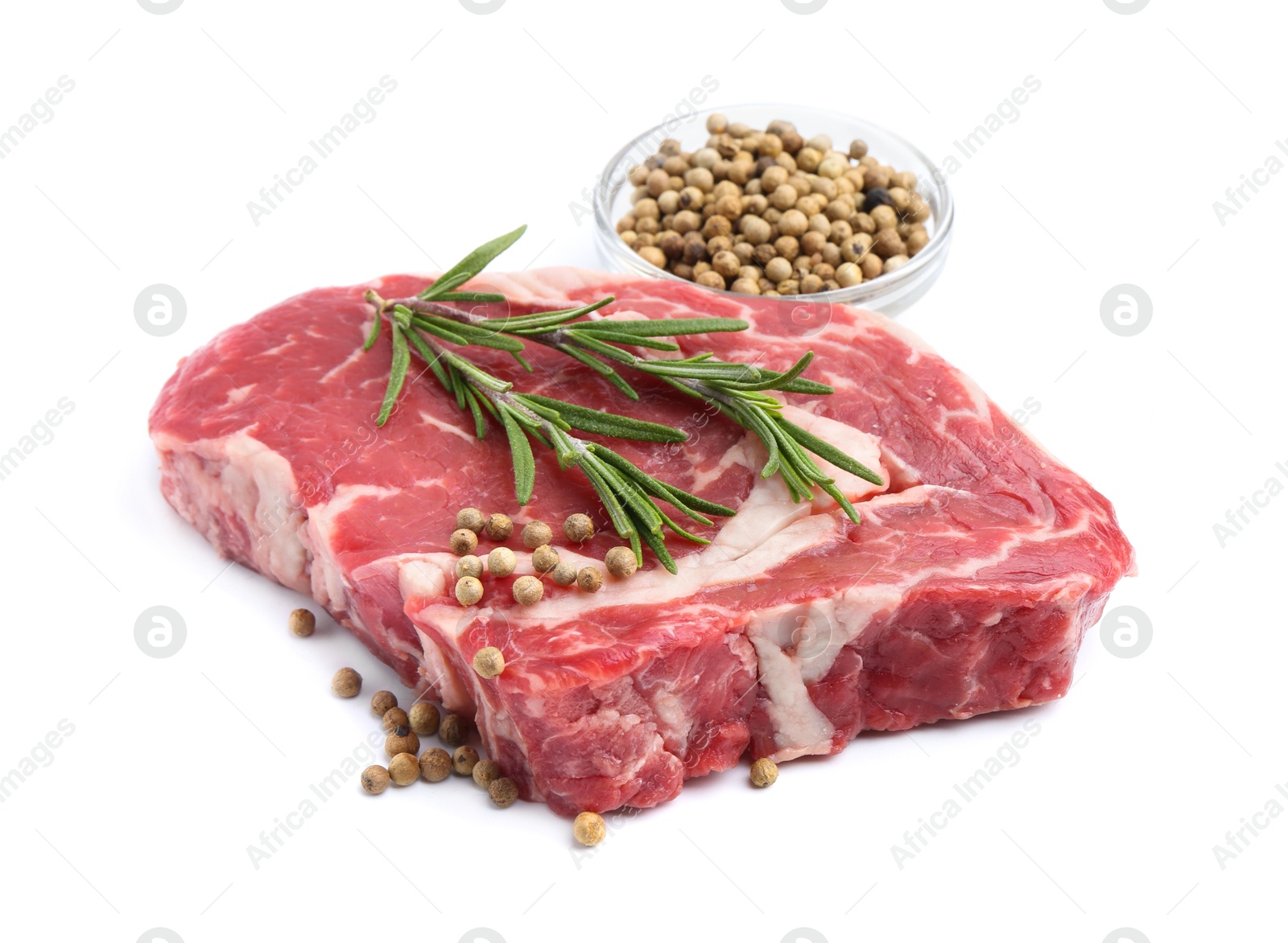 Photo of Piece of raw beef meat and spices isolated on white