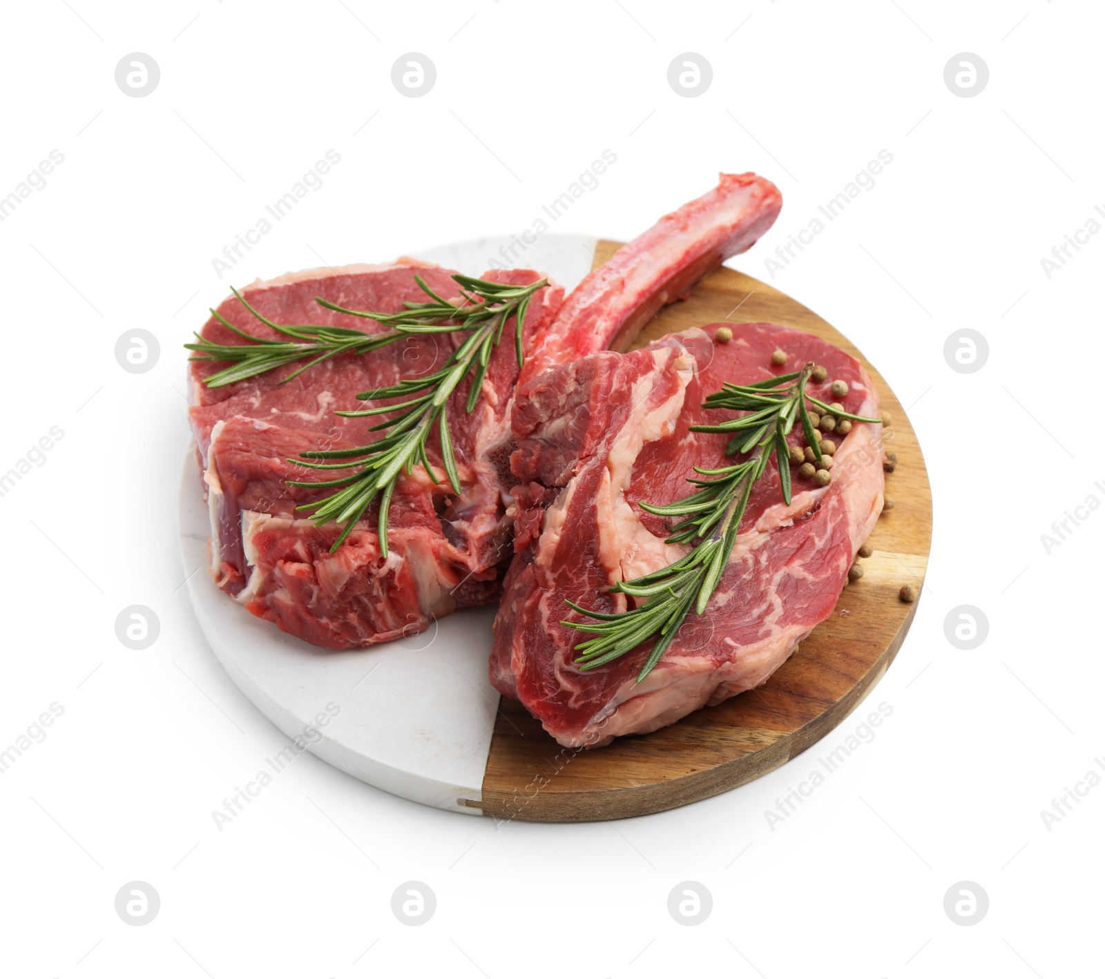 Photo of Pieces of raw beef meat and spices isolated on white