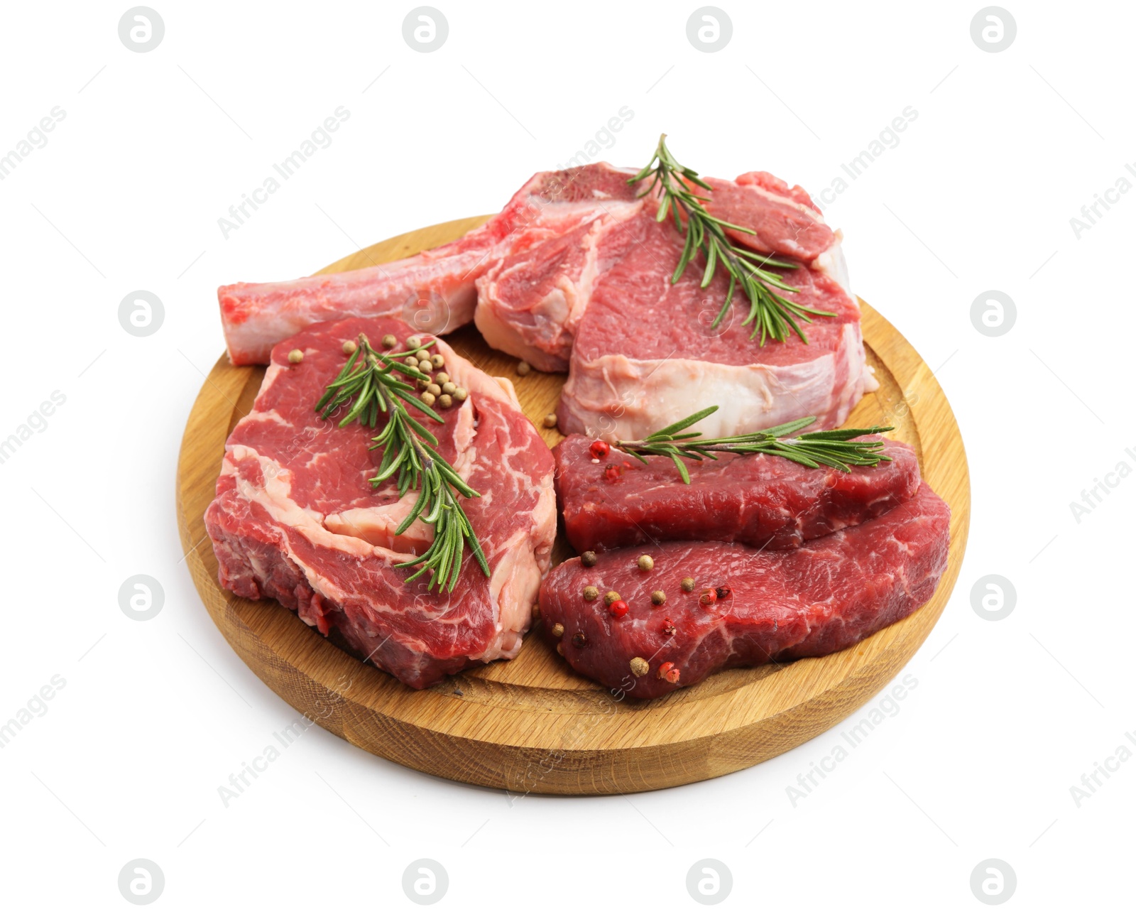 Photo of Pieces of raw beef meat and spices isolated on white