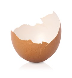 Photo of One piece of broken eggshell on mirror surface against white background