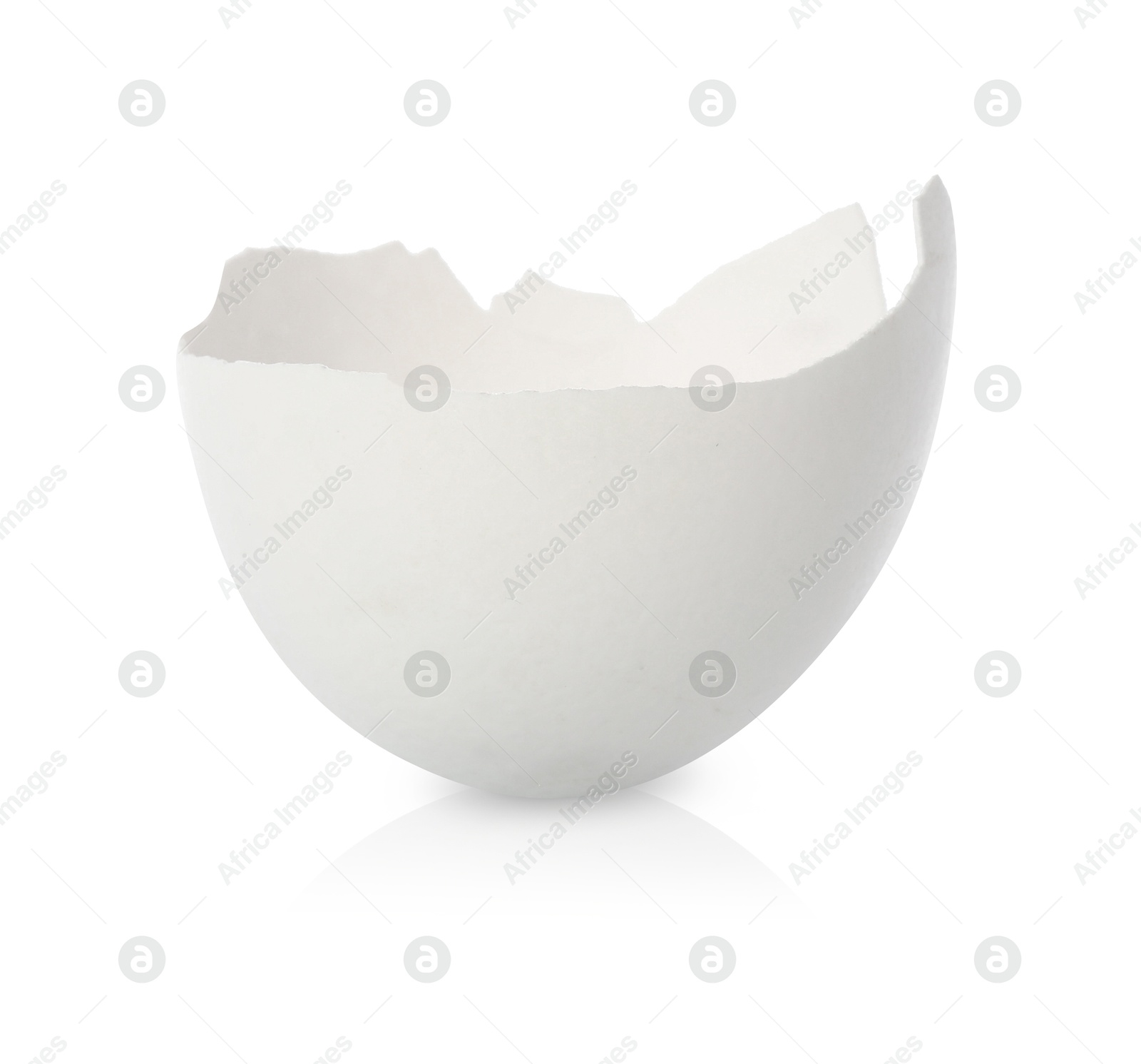 Photo of One piece of broken eggshell on mirror surface against white background