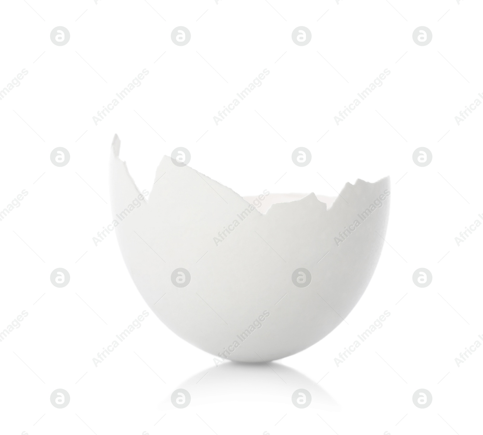 Photo of One piece of broken eggshell on mirror surface against white background