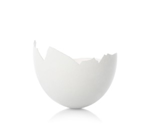 Photo of One piece of broken eggshell on mirror surface against white background