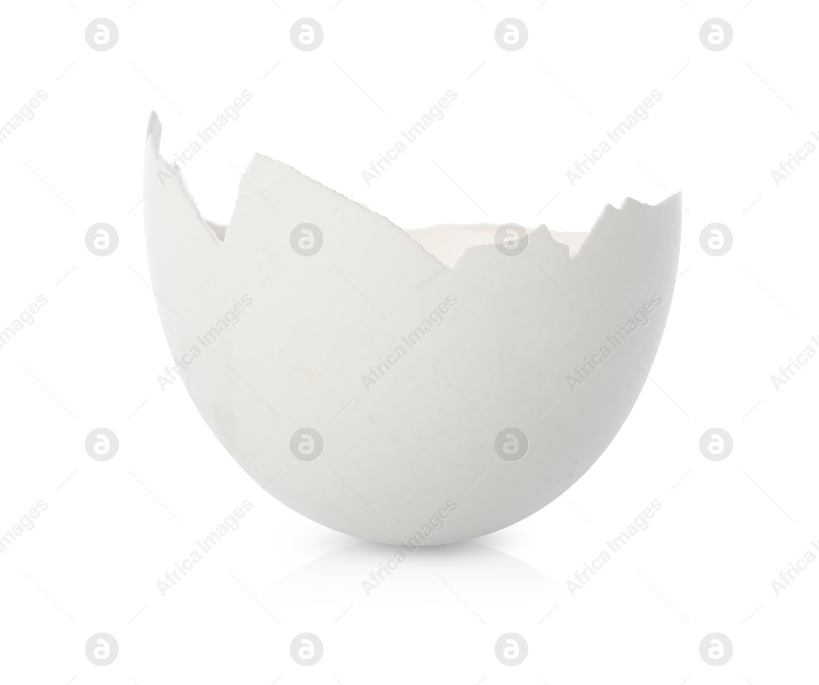 Photo of One piece of broken eggshell on mirror surface against white background