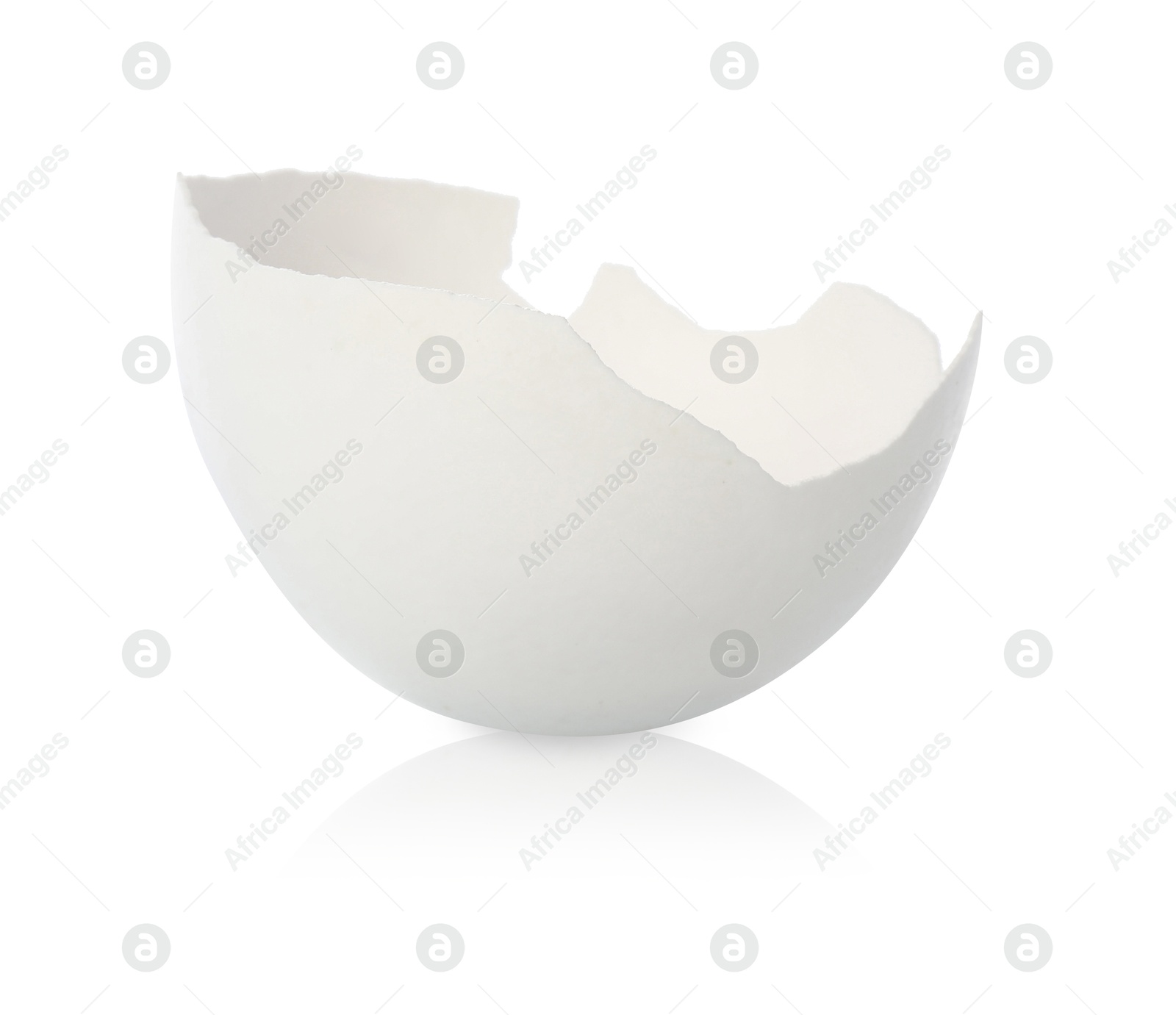 Photo of One piece of broken eggshell on mirror surface against white background