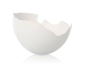 Photo of One piece of broken eggshell on mirror surface against white background