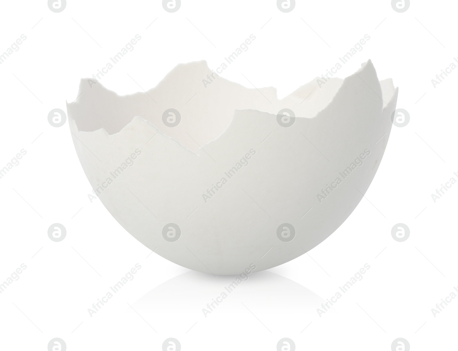 Photo of One piece of broken eggshell on mirror surface against white background