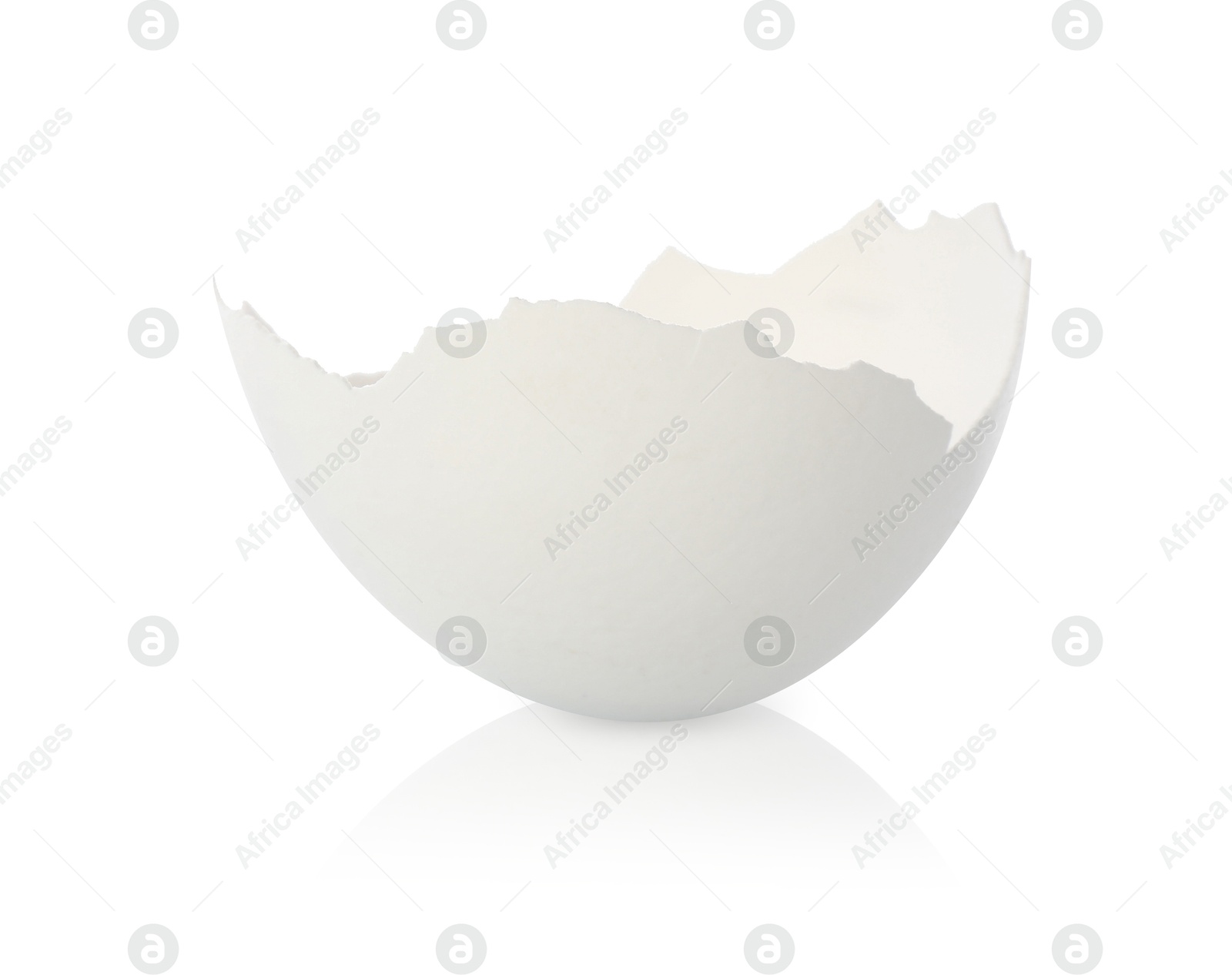 Photo of One piece of broken eggshell on mirror surface against white background