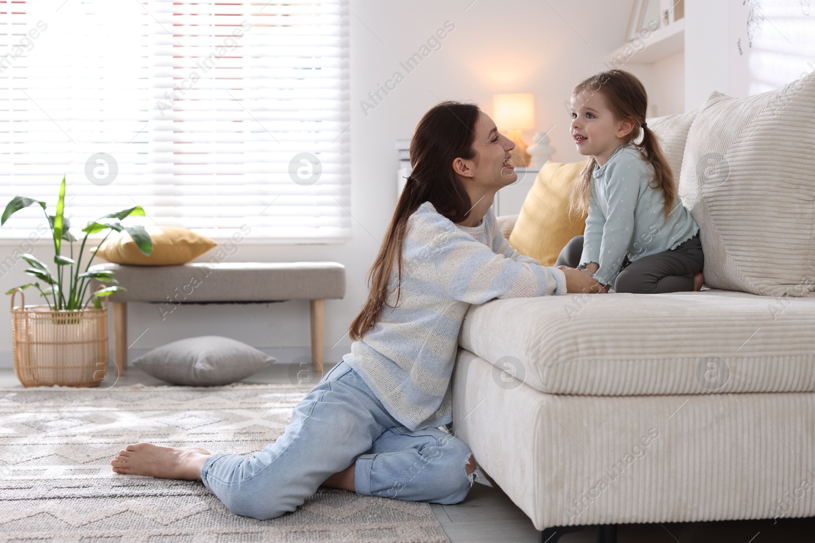 Photo of Happy mother with her cute little daughter at home