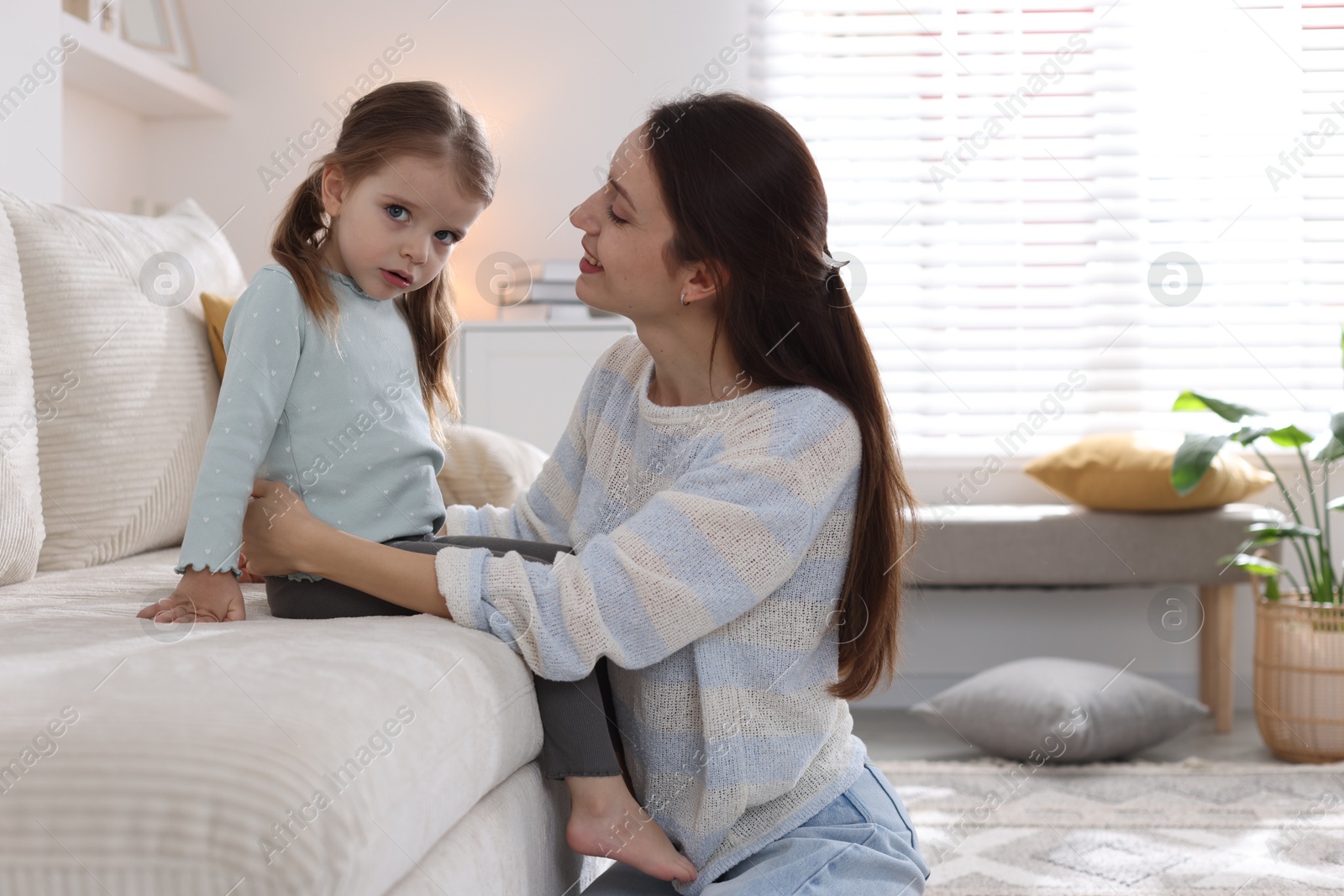 Photo of Happy mother with her cute little daughter at home