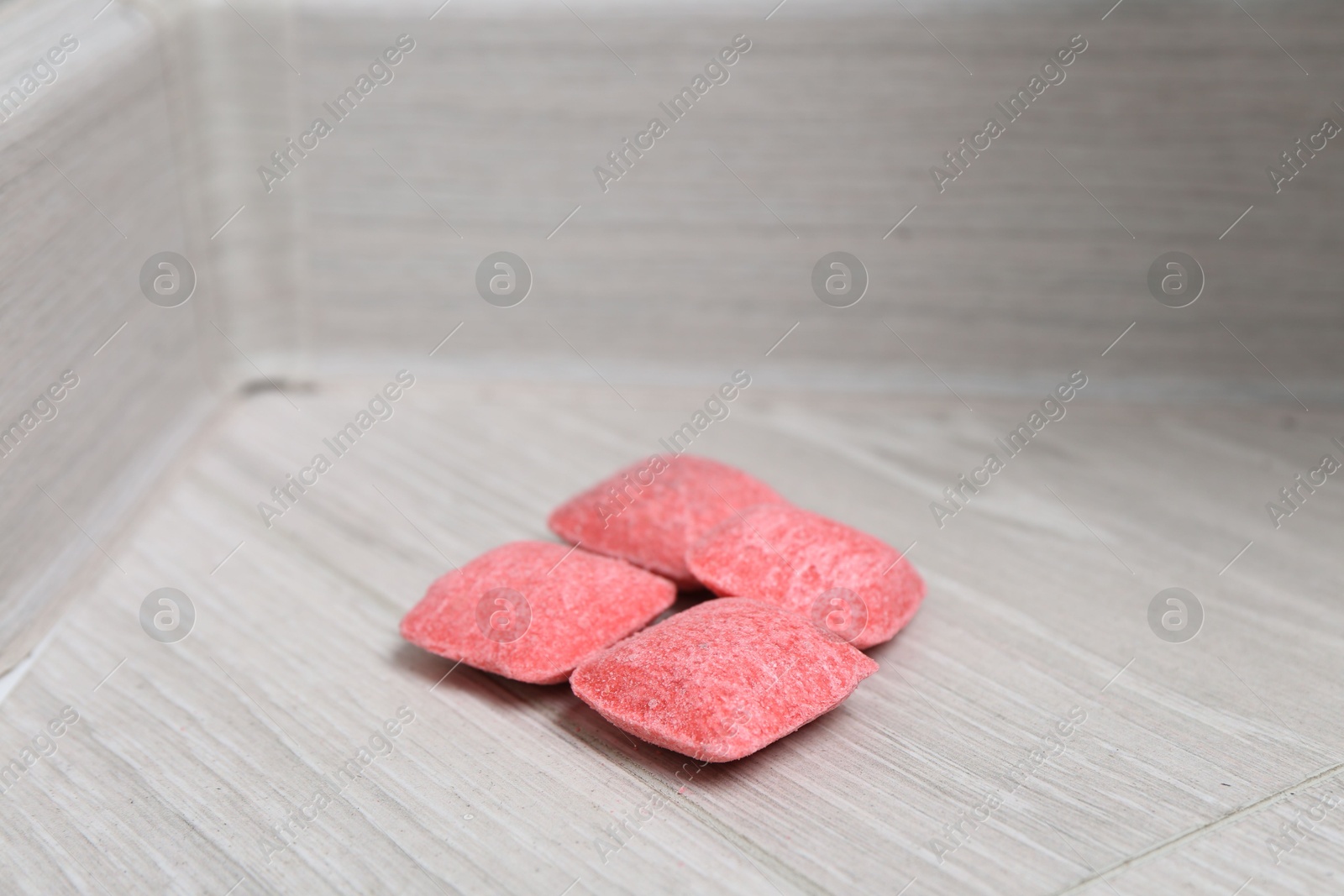 Photo of Rat poison on floor indoors, closeup view