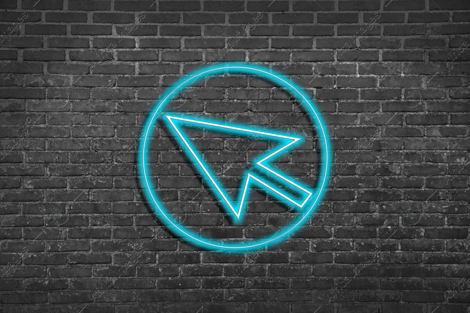 Image of Neon pointer with arrow on grey brick wall