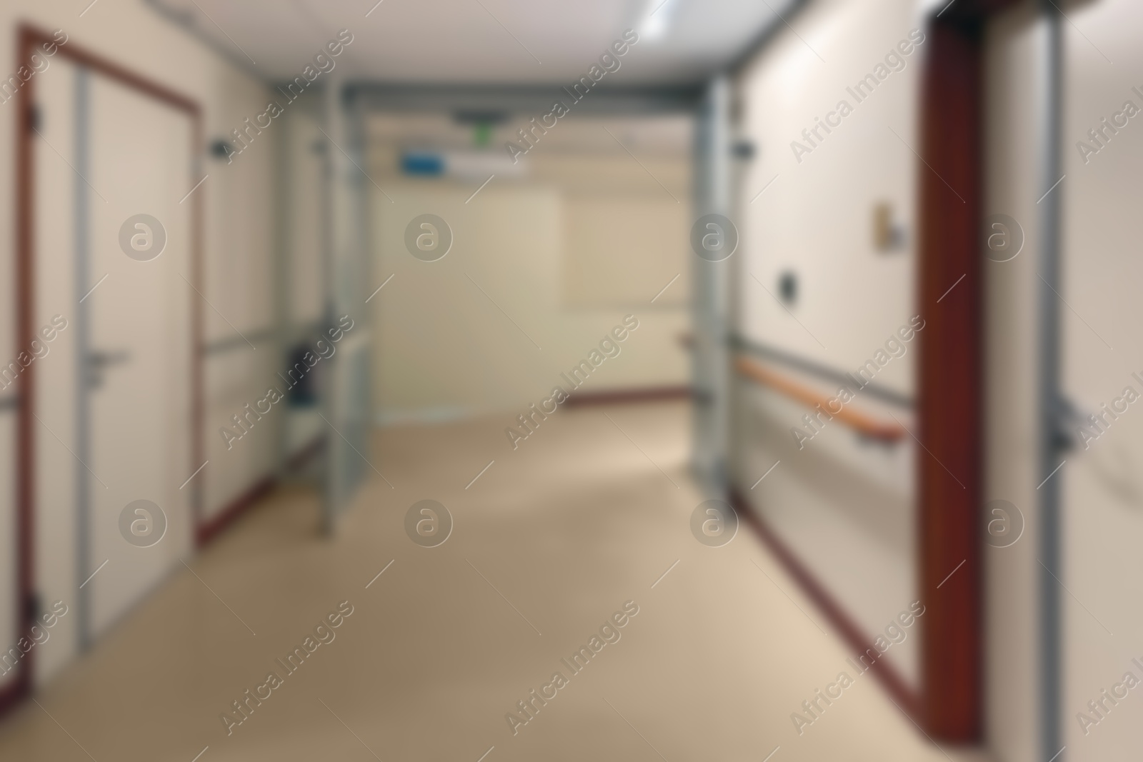 Image of Blurred view of empty hospital corridor with doors