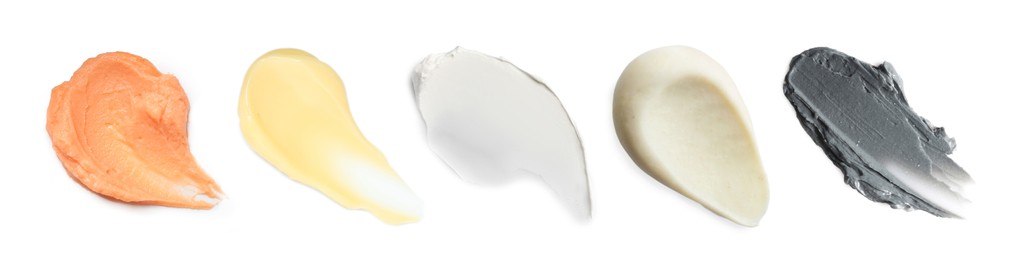 Image of Samples of different creams isolated on white, top view