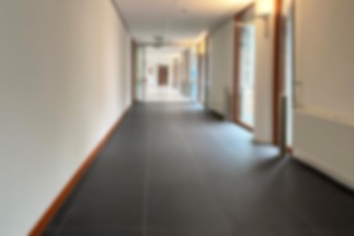 Image of Blurred view of empty hospital corridor with doors