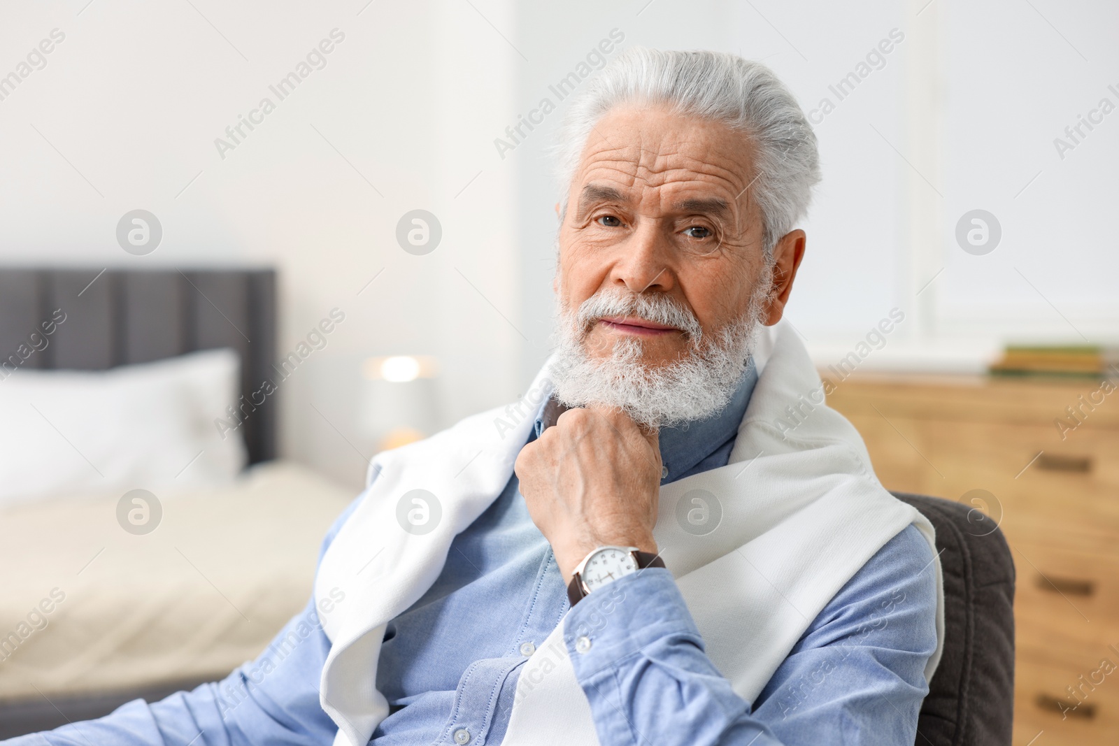 Photo of Portrait of handsome bearded man at home