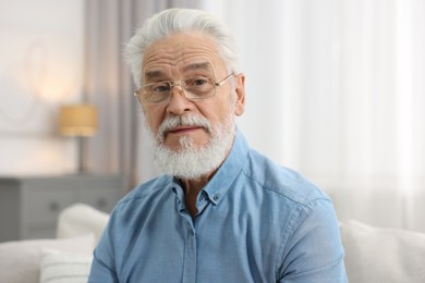 Photo of Portrait of handsome bearded man at home