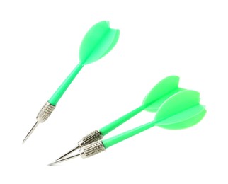 Photo of Green dart arrows in air isolated on white