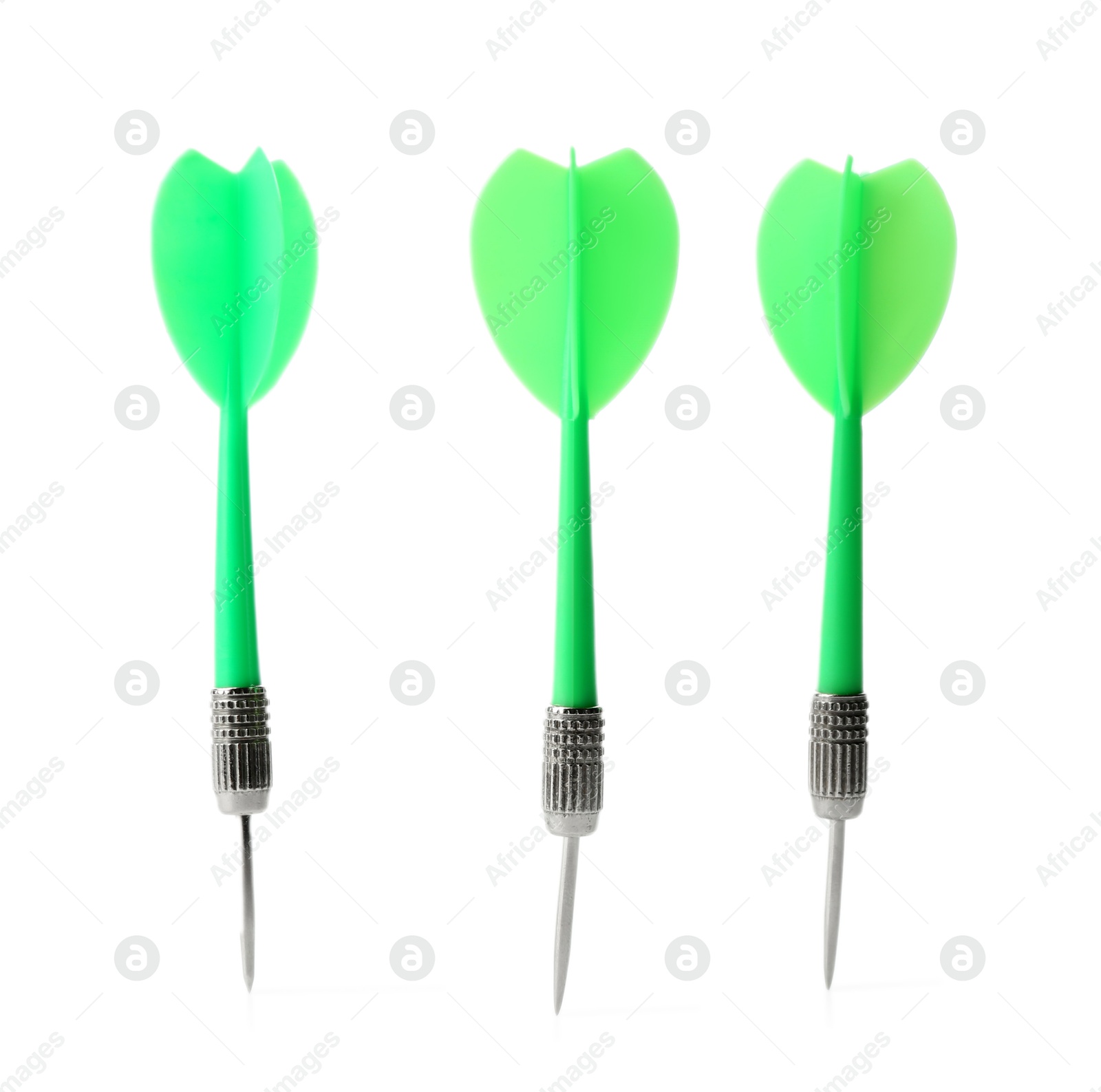 Photo of Green dart arrows in air isolated on white