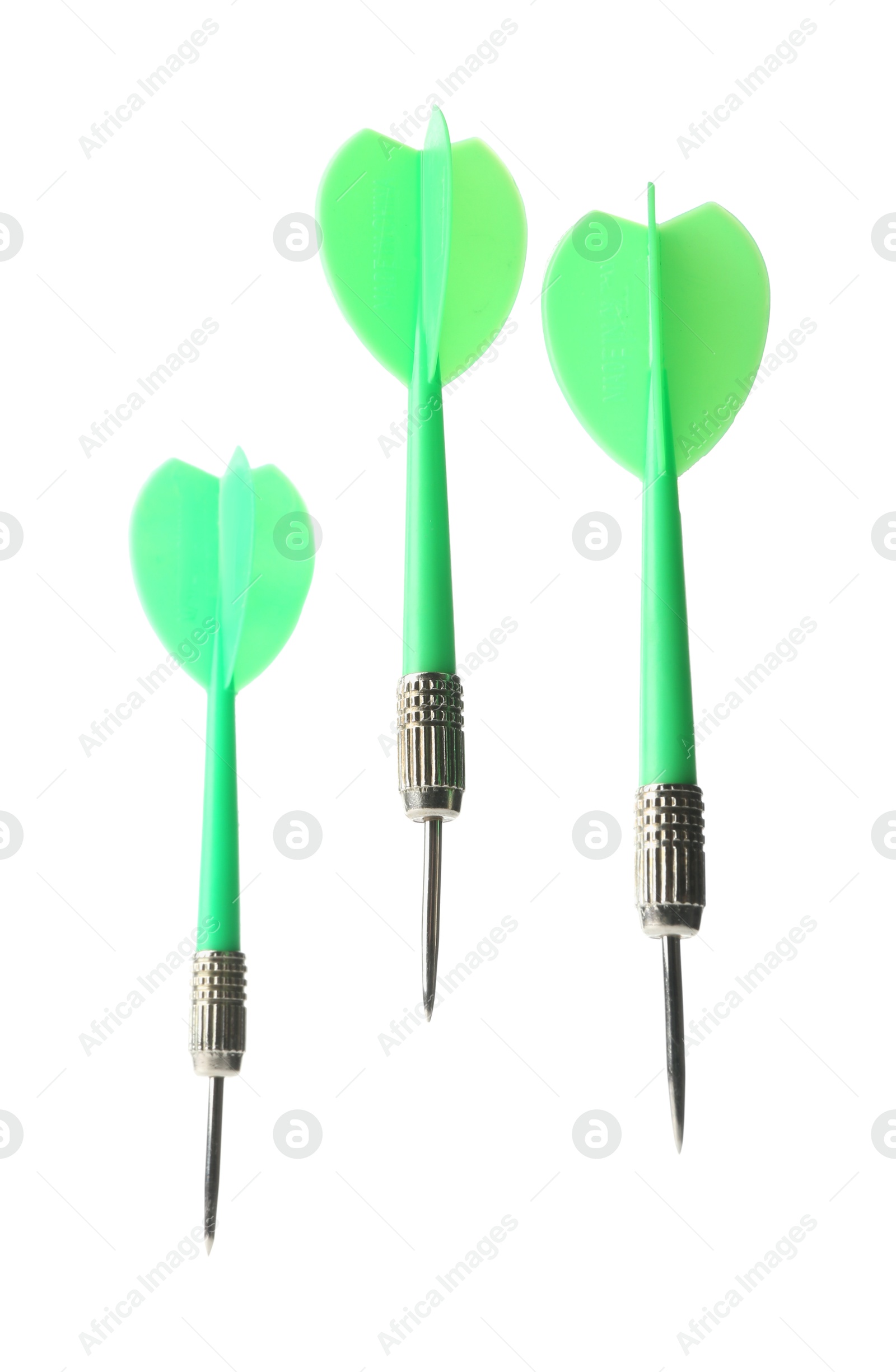 Photo of Green dart arrows in air isolated on white