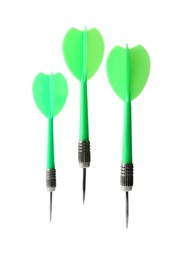 Photo of Green dart arrows in air isolated on white