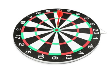 Photo of Dart board with red arrow hitting target isolated on white