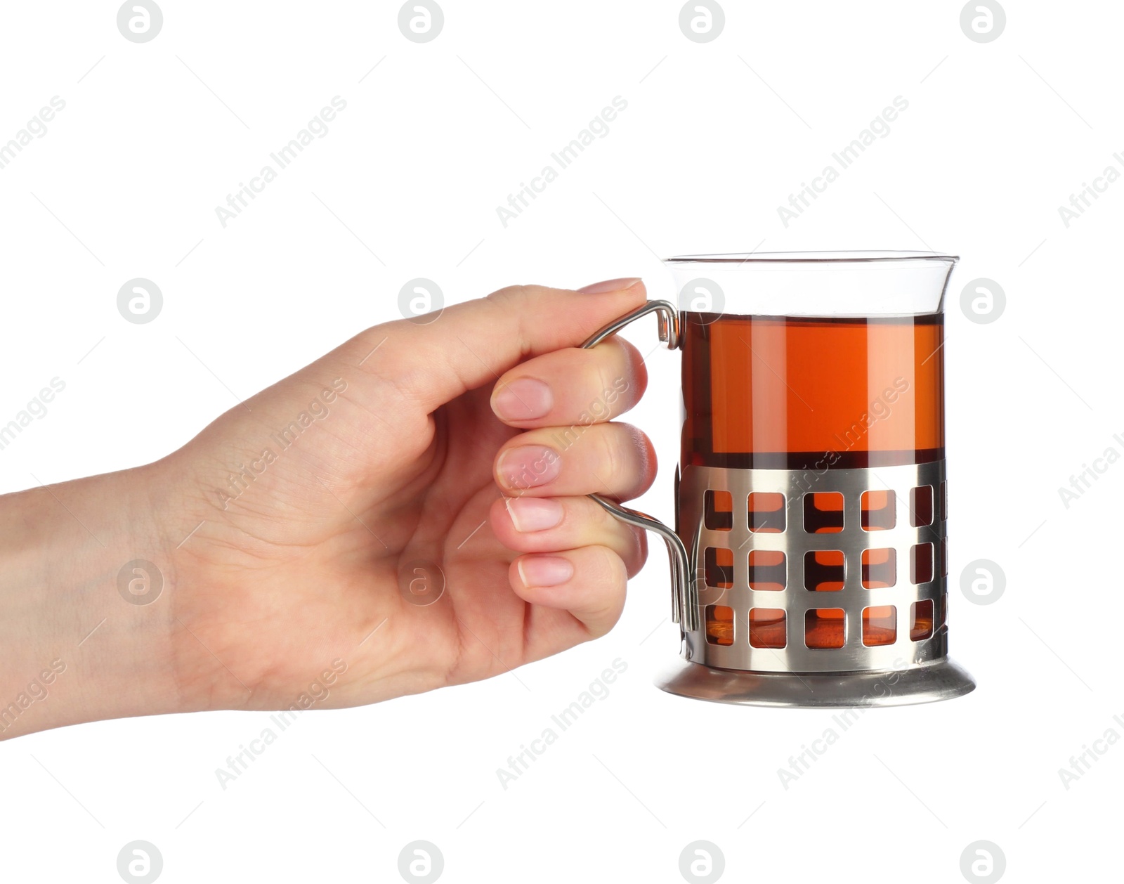 Photo of Woman holding glass of aromatic tea in holder on white background, closeup