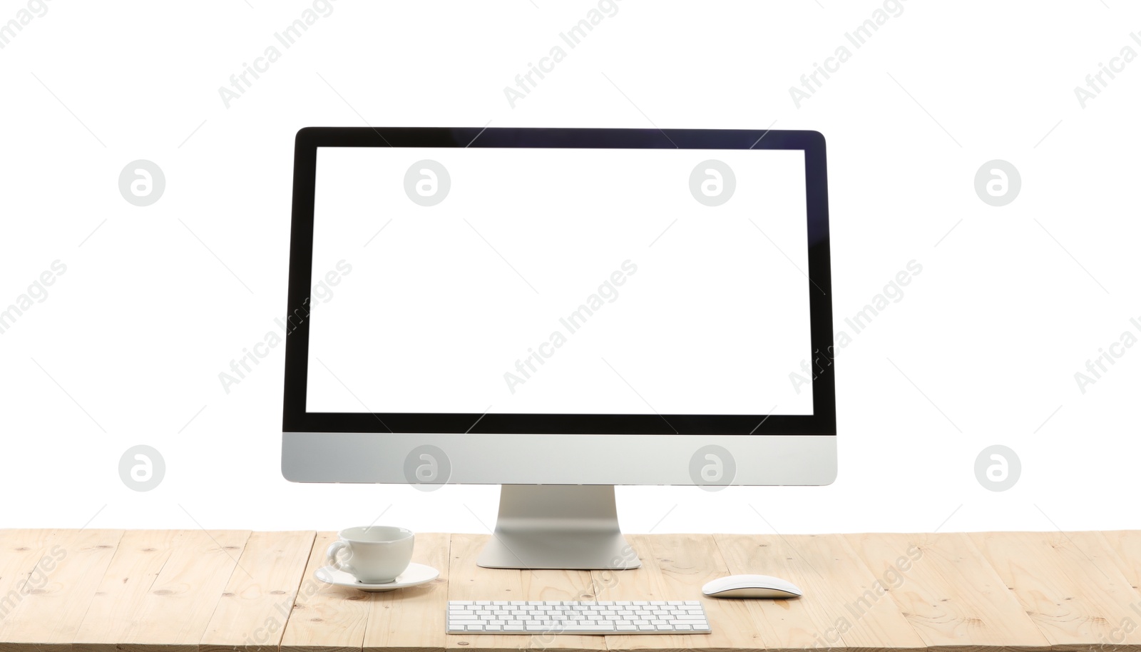 Photo of Computer monitor, keyboard, mouse and cup of drink on wooden desk against white background