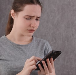 Photo of Stressed woman calling hotline for mental health help at home