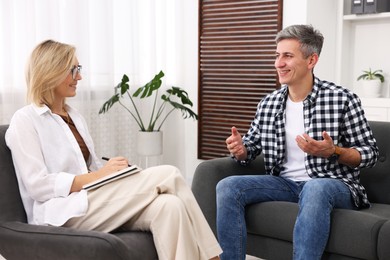 Photo of Professional psychologist working with patient in office