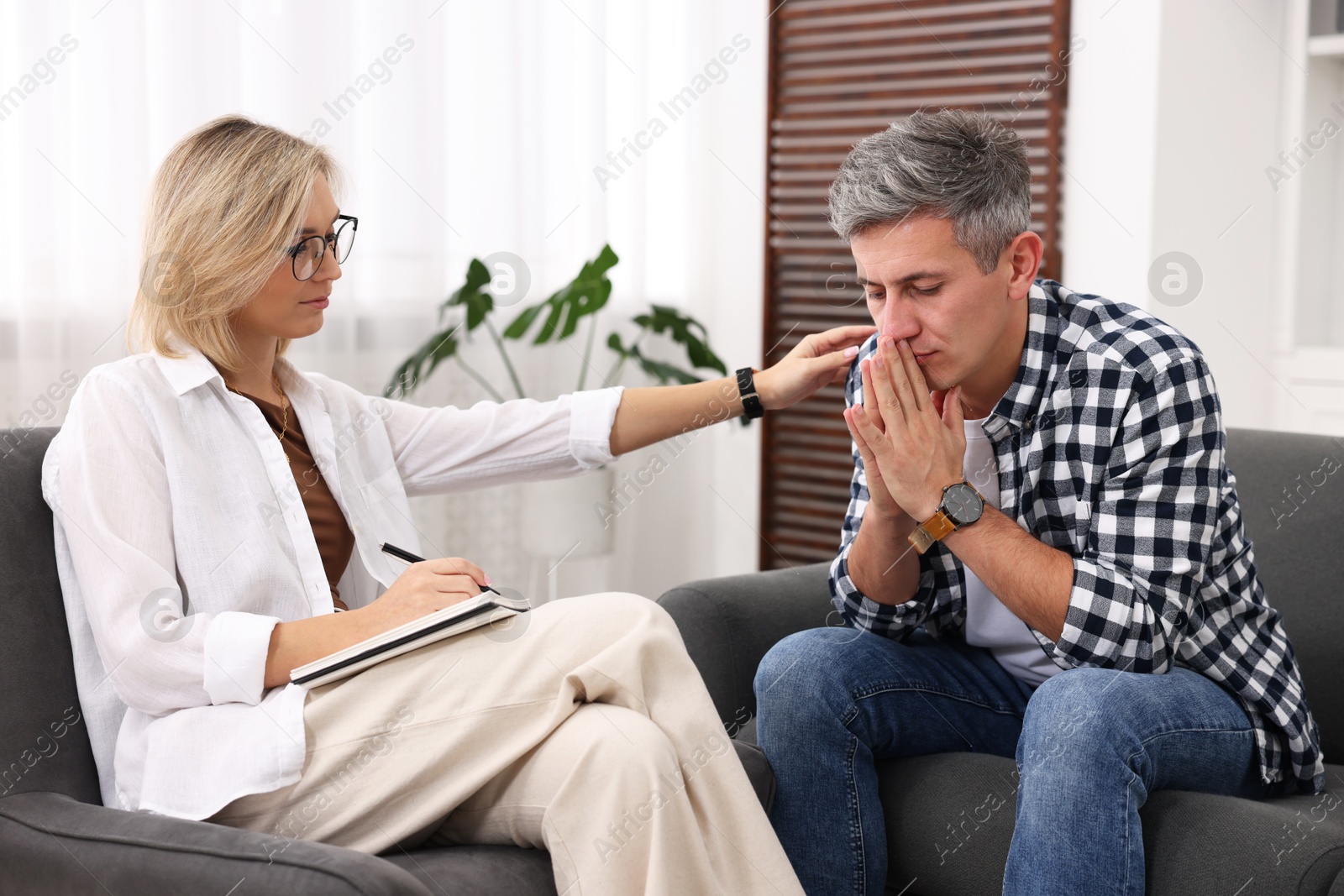 Photo of Professional psychologist working with patient in office