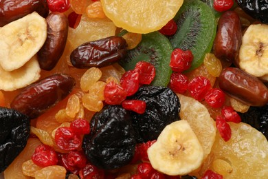 Photo of Mix of different dried fruits as background, closeup