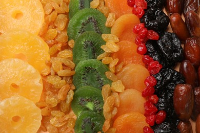 Photo of Different dried fruits as background, top view