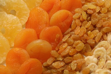 Photo of Different dried fruits as background, top view