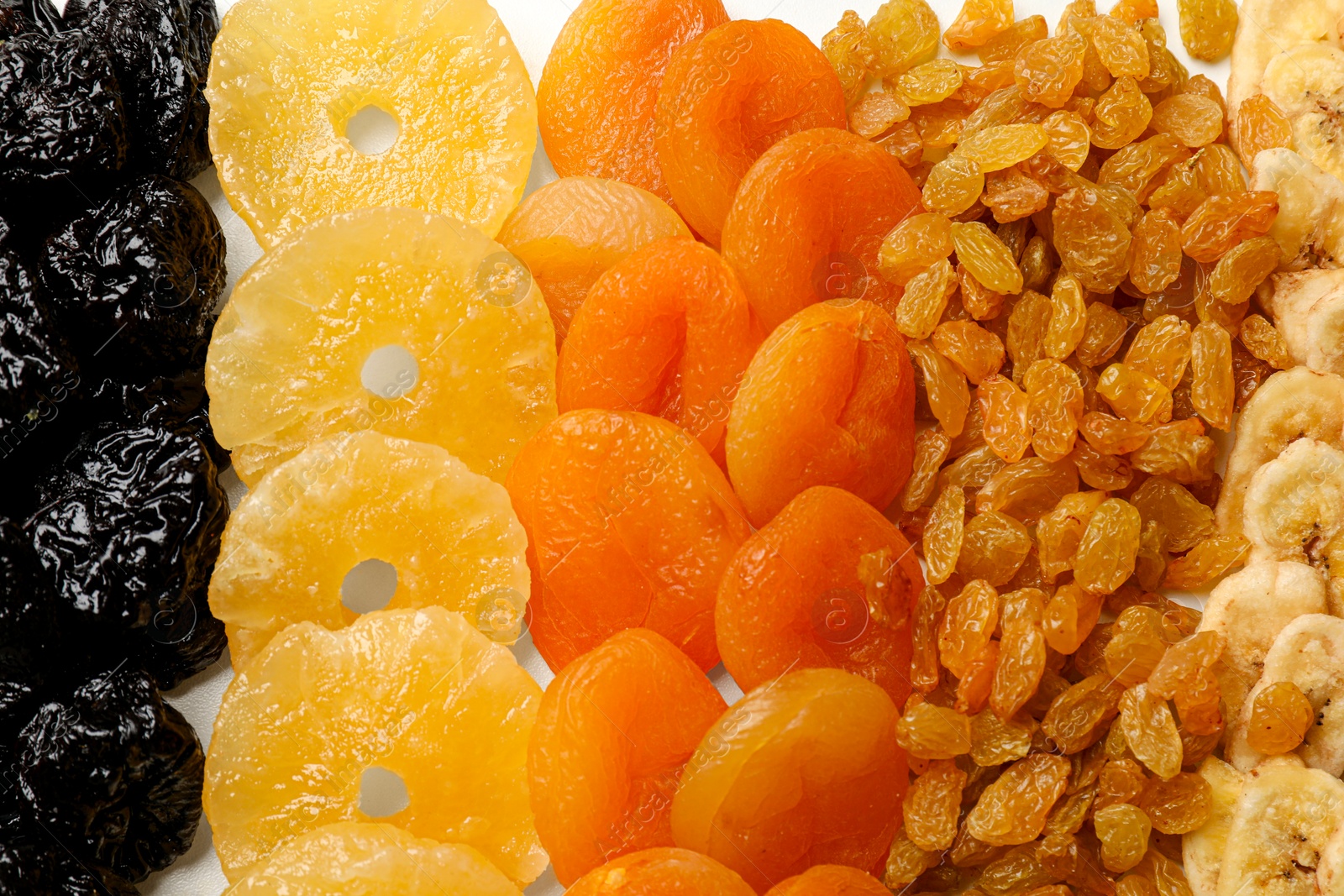 Photo of Different dried fruits on table, top view