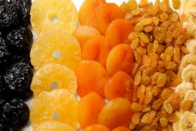 Photo of Different dried fruits on table, top view