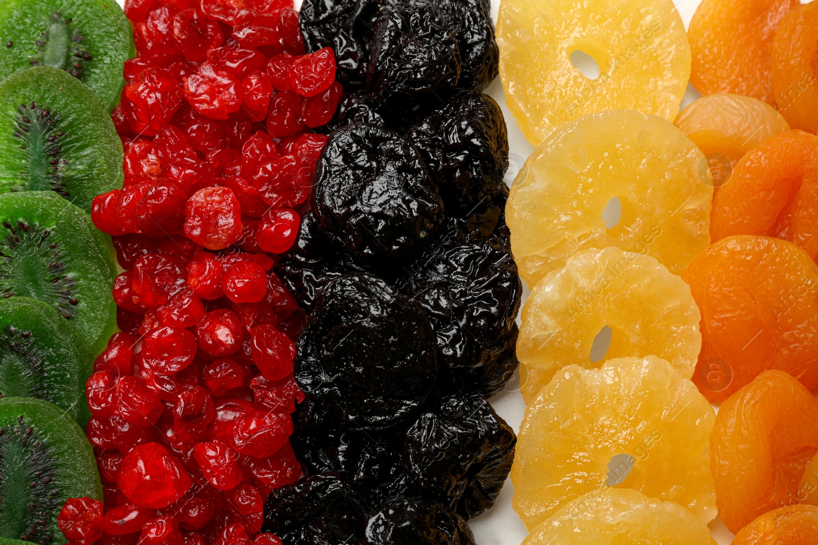 Photo of Different dried fruits on table, top view