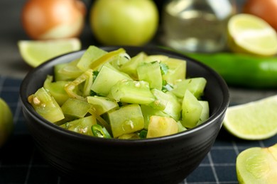 Photo of Delicious salsa (Pico de gallo) in bowl on table, closeup